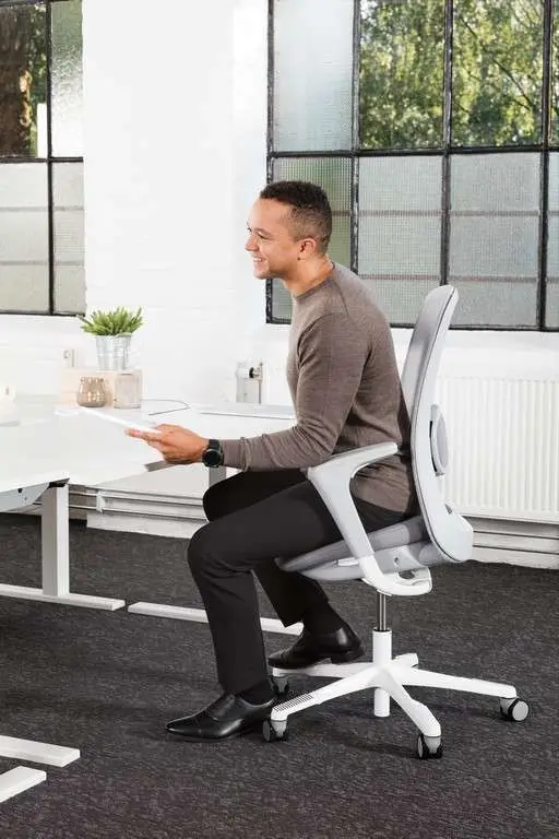 man-sitting-on-white-hag-sofi-mesh